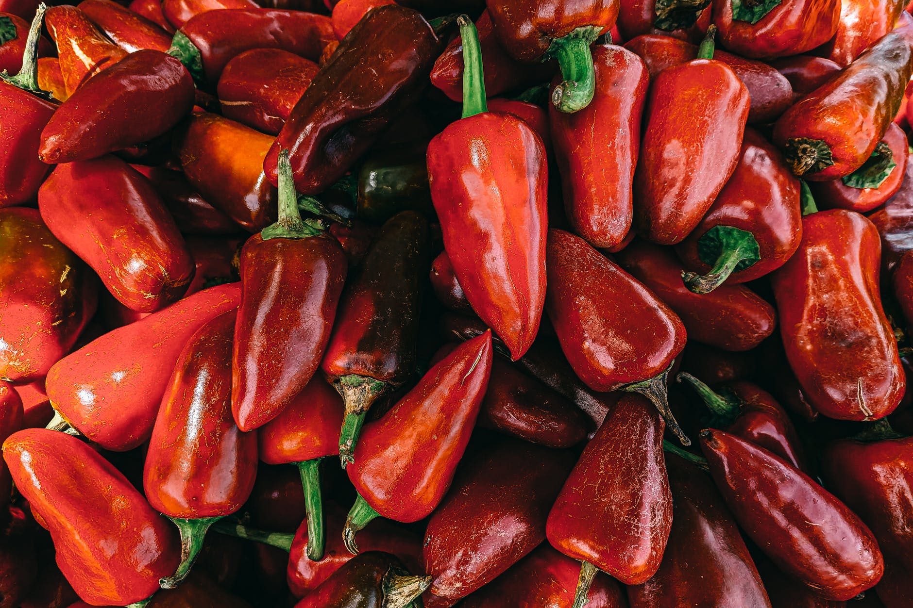 red bell pepper lot in close up photography